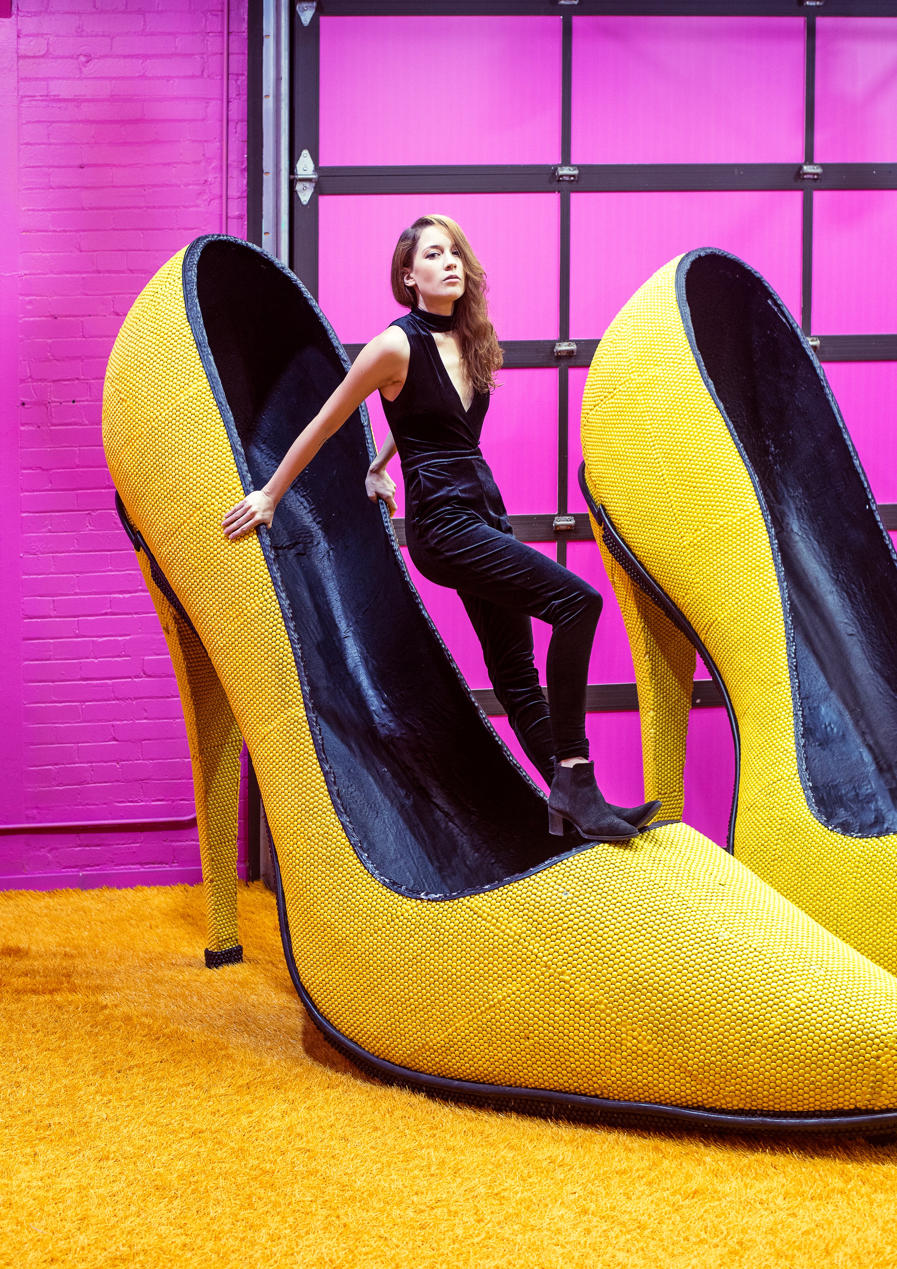 https://popularbees.com/cdn/shop/files/female-model-balances-inside-a-giant-yellow-shoe.jpg?v=1687882270&width=3840